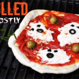Grilled Halloween pizza with cheese ghosts and olive spiders. Too cute! This kids will love this! : )