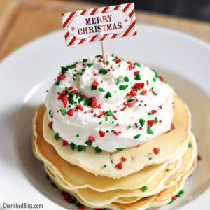 Enjoy these Merry Christmas Chocolate Chip Pancakes with Homemade Whipped Topping. Perfect for that Christmas morning!