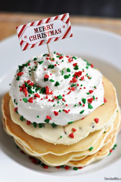 Enjoy these Merry Christmas Chocolate Chip Pancakes with Homemade Whipped Topping. Perfect for that Christmas morning!
