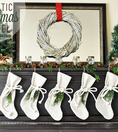 A Rustic Christmas Mantel featuring real cedar garland and drop cloth stockings