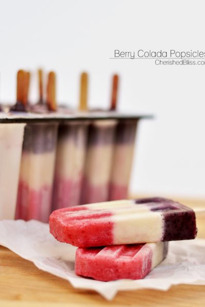 These Berry Colada Popsicles are perfect for Memorial Day Weekend or Forth of July because of their natural red, white, and blue beauty. When serving these fun popsicles you are sure to receive smiles for young to old!
