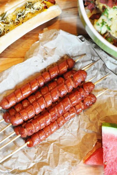 These grilled spiral cut hot dogs are a fun way to present the original hot dog and dress up your traditional cook out menu.