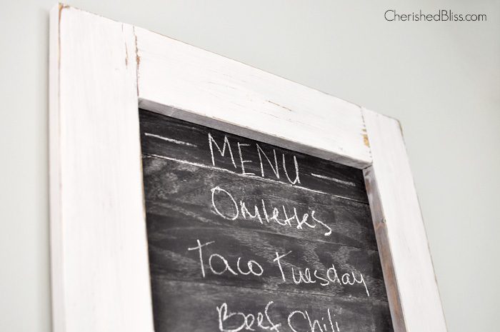 Is the family always asking what's for dinner? Create this super cute planked Kitchen Chalkboard Menu to keep them up to date! Click through for the tutorial on how to make this chalkboard menu! 