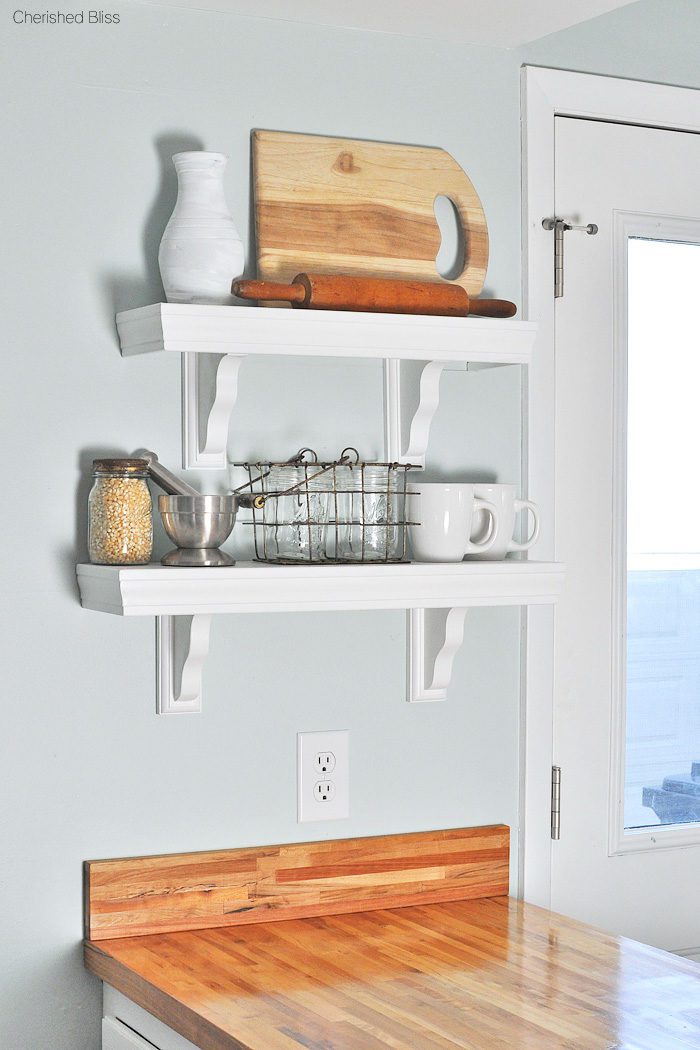 Love this beautiful Farmhouse Cottage Kitchen. Shaker style cabinets, butcher block counter tops, and cast iron sink. All done on a budget! 