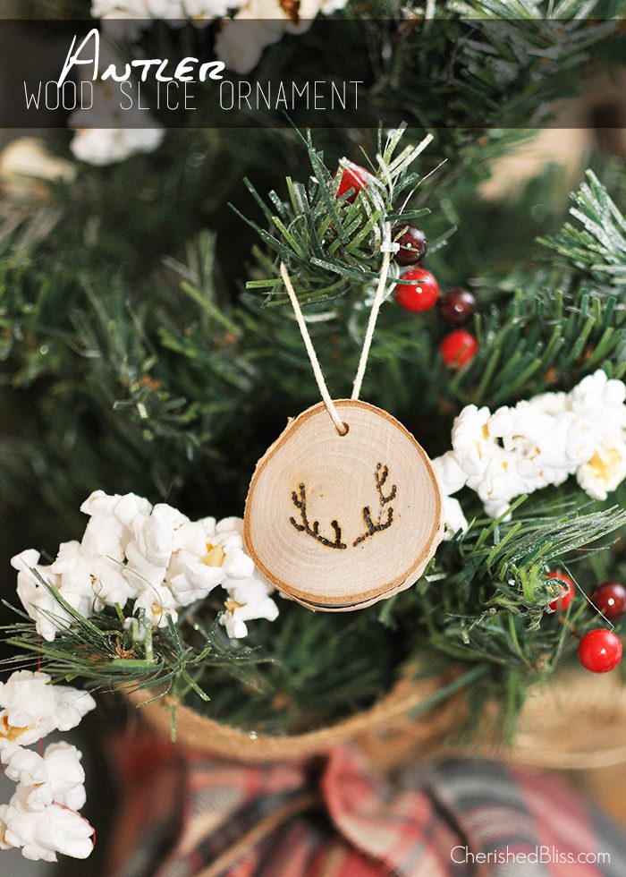 Add a rustic touch to your Christmas tree this year with these easy to make Antler Wood Slice Ornaments. Tutorial via cherishedbliss.com