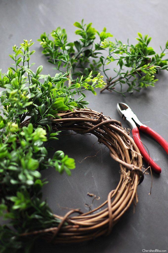 Add a beautiful wreath to your decor that will get you through ever season with this DIY Boxwood Wreath Tutorial via cherishedbliss.com 