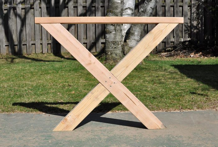 Build this DIY Outdoor Table featuring a Herringbone Top and X Brace Legs! Would also make a great Rustic Dining Room Table! 
