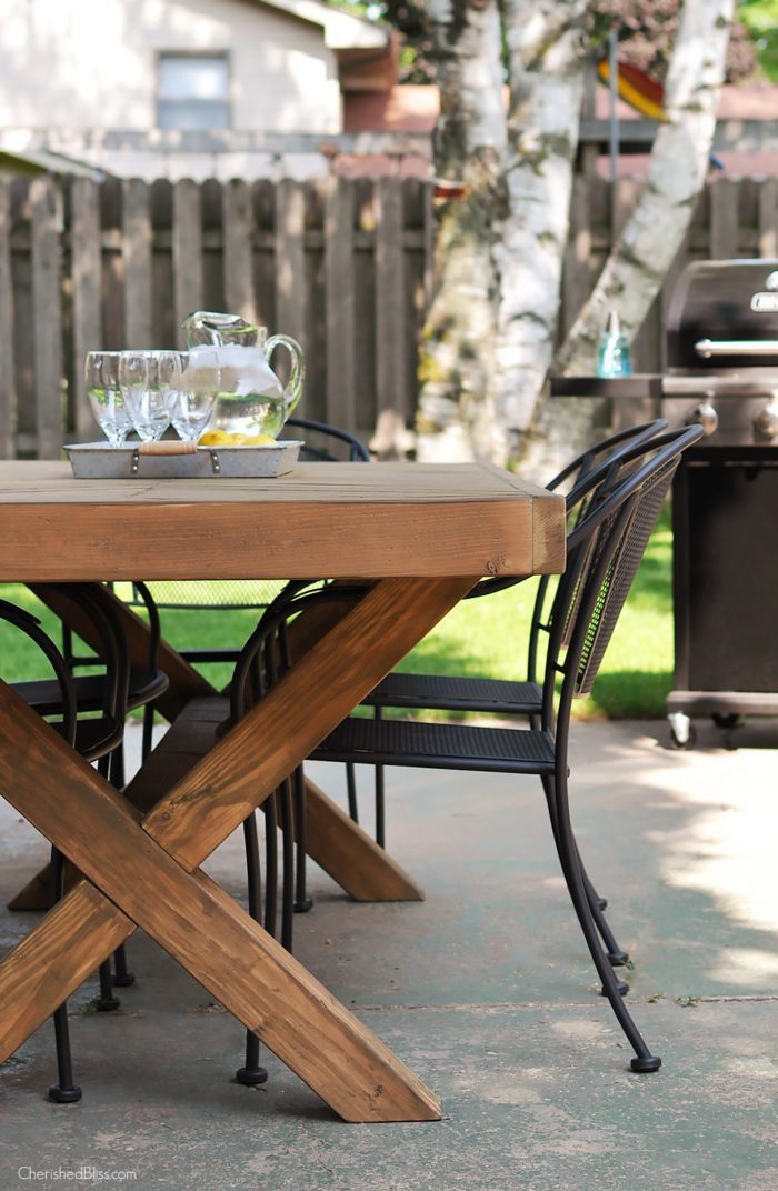 Build this DIY Outdoor Table featuring a Herringbone Top and X Brace Legs! Would also make a great Rustic Dining Room Table! 