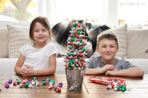 Create beautiful memories with your family by making a simple Hershey's Kisses Christmas Tree!