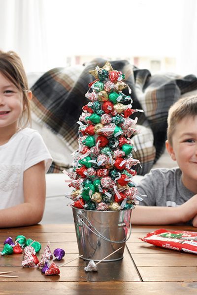 Create beautiful memories with your family by making a simple Hershey's Kisses Christmas Tree!