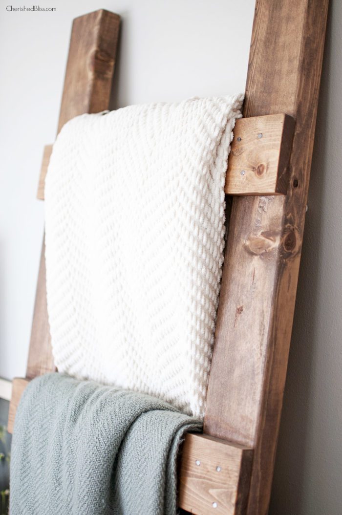Learn how to make a DIY Blanket Ladder. With this simple tutorial and only 3 basic tools you can save space while neatly storing your blankets. 