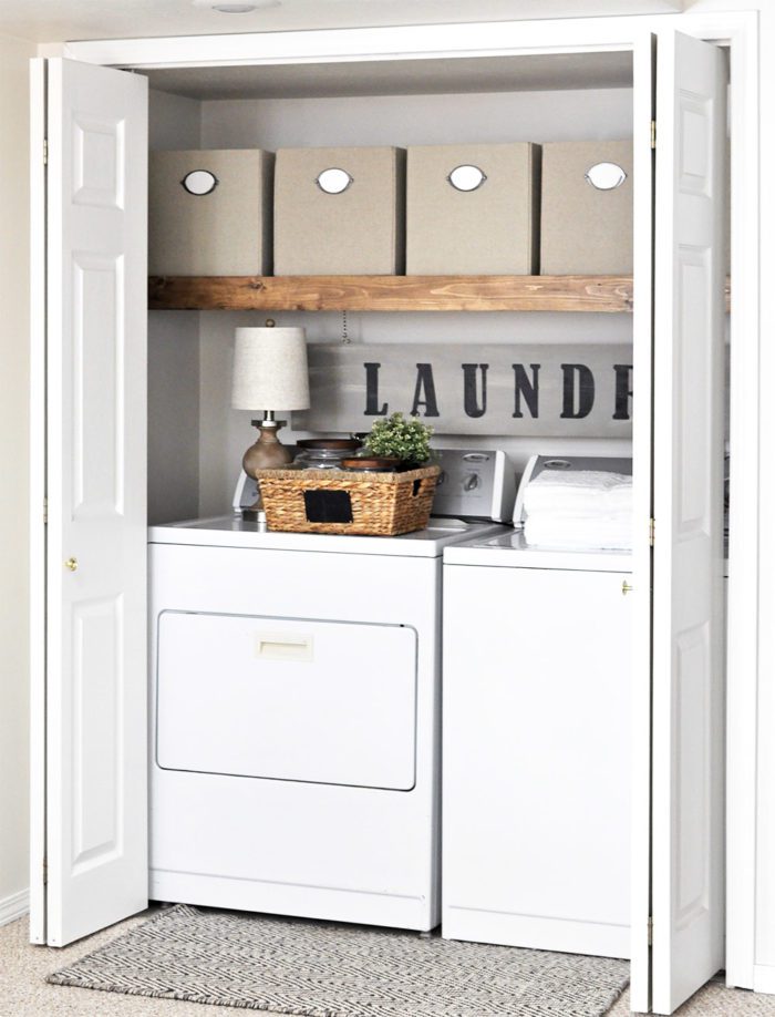 This Laundry Room Makeover transforms this little closet with wasted space into a functional laundry area with just a few simple changes! 