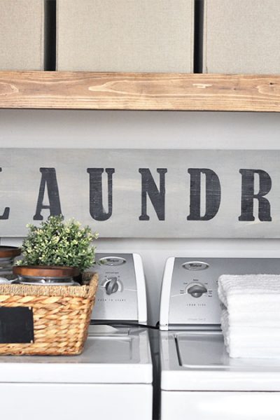 This Laundry Room Makeover transforms this little closet with wasted space into a functional laundry area with just a few simple changes!
