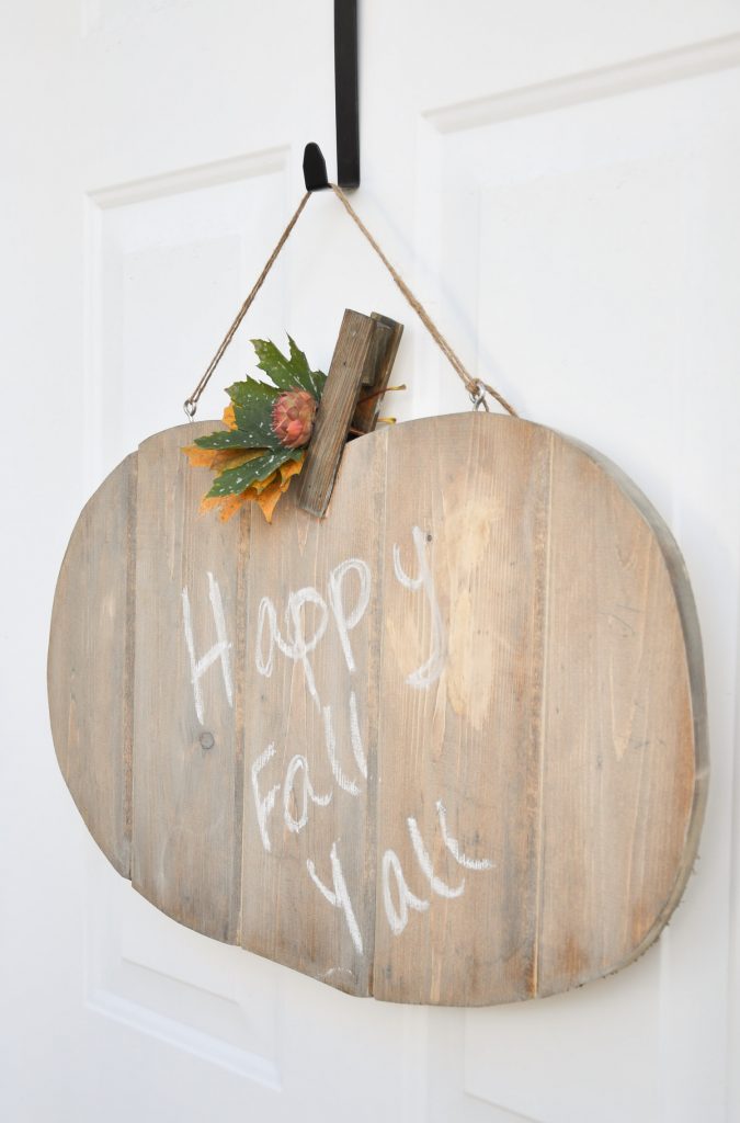 Learn how to build this Rustic Pumpkin Door Hanger. This tutorial can easily be transitioned for any seasonal character. Your imagination is the limit! 