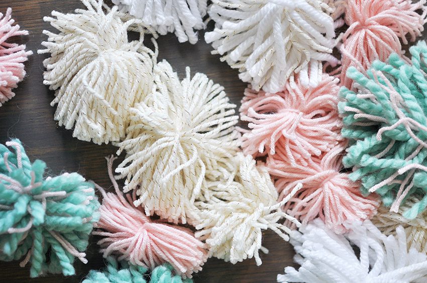 Learn how to create this amazing DIY Pom Pom Rug using Bucilla's new RyaTie™ Kits. This modern take on working with yarn is the perfect addition to any room