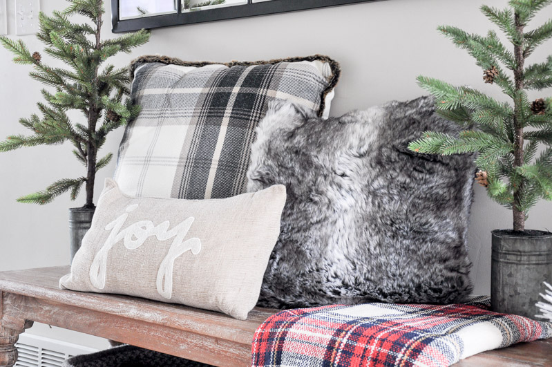 Come tour our Cozy Christmas Entryway decorated with comfy pillows, blankets and even a little hidden shoe storage!