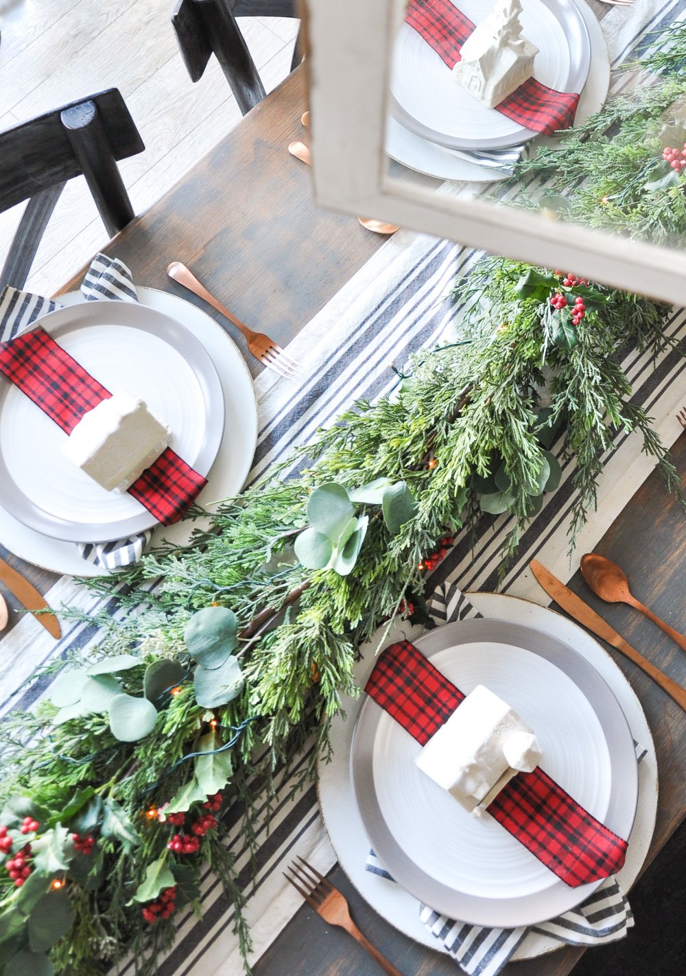 This unique Christmas Village Holiday Tablescape provides a simple way to bring a little Christmas Cheer to your home using things you likely have on hand! 
