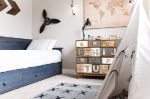 Every little boy needs a big boy bedroom at some point or another and this Navy and Gray Big Boy Bedroom is the perfect blend of simple, functional and stylish.