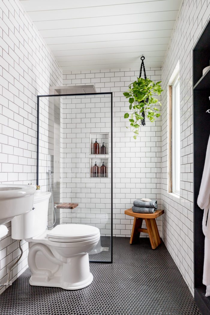 Use a shower screen in a bathroom to make the room feel bigger like this industrial bathroom.