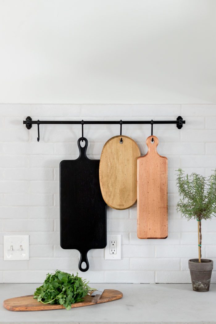 Hang Cutting Board in Kitchen to save on storage. 