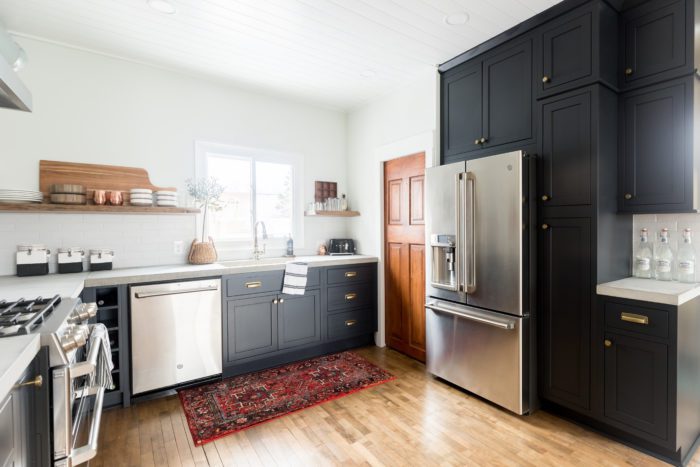 Dark inset cabinets, wood accents, mixed metals and industrial appliances give this Rustic Modern Kitchen a cozy, clean look. 