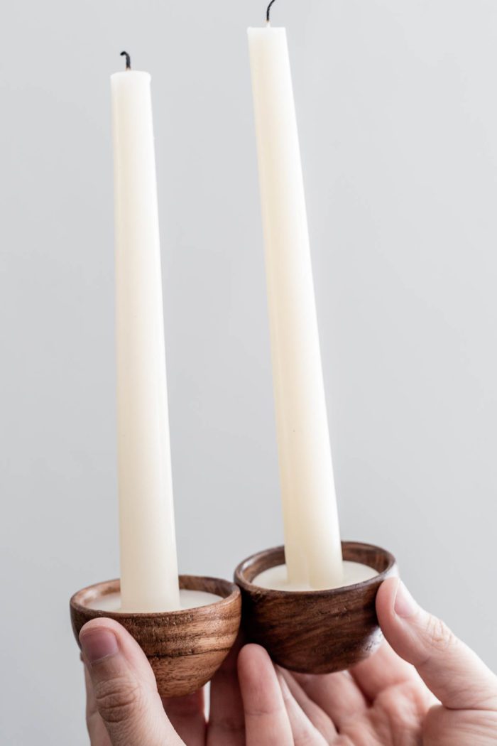 Skinny Candles displayed in Mini Wooden Bowls.